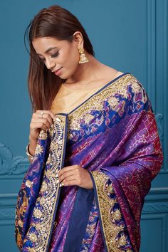 Look royal at weddings and festive occasions in this alluring purple embroidered Patola silk saree, It comes with a matching blouse piece. Disclaimer: The shown stitched blouse on the model is for display purpose only. The saree comes with a matching blouse piece and finished with fall and piko. Festive Purple Tussar Silk Pre-draped Saree, Bollywood Style Purple Art Silk Pre-draped Saree, Purple Dola Silk Pre-draped Saree, Purple Embroidered Silk Saree, Traditional Purple Pre-draped Saree, Purple Pre-draped Saree With Dupatta, Purple Banarasi Silk Sets With Zari Work, Purple Silk Embroidered Saree Fabric, Festive Purple Embroidered Fabric For Designer Wear