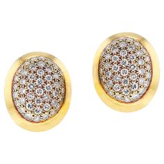 A pair of French Cartier Oval Diamond Earrings made in 18k Yellow Gold. The total weight of the diamonds is 1.80 carats. The clarity is VVS2, VS1, and Color is F/G. Signed and Numbered. French Marks. The dimensions are 0.72 inches x 0.61 inches. The total weight of the earrings are 11.93 grams. 1402-EJYUAJRT