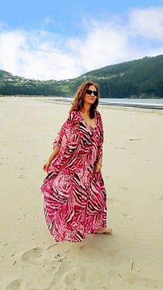 Kaftan Pink Zebra  has side ribbons which allows it to be worn wider or to tighten it to the body, you can also tie them in front or behind giving the kaftan another shape as seen in the photos. The fabric is light, soft and drape that flows with our movement in a very flattering print. It is a versatile, comfortable, elegant and timeless garment.  An essential with a lot of style that will give you a feeling of freedom and comfort. You can wear it on multiple occasions ... Combine it with diffe Pink Floor-length Maxi Dress For Vacation, Printed Flowy Kaftan For Beach Cover-up, Flowy Printed Dresses For Beach Cover-up, Printed Maxi Boho Dress For Beach Season, Pink Summer Kaftan For Beach Cover-up, Printed Maxi Length Boho Dress For Beach Season, Printed Floor-length Boho Vacation Dress, Floor-length Printed Boho Dress For Vacation, Floor-length Printed Boho Vacation Dress