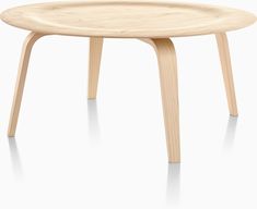 the plywood coffee table is made from wood and has an oval top with legs