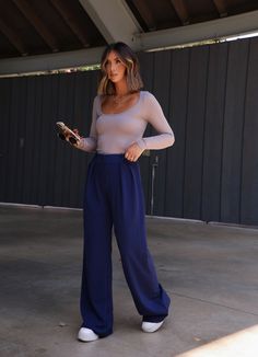 Our Navy Nights Pants offer a perfect blend of professional style and comfort. Crafted with a soft material, elevated stitching, pleated design, and wide leg, these pants exude sophistication and provide a rich pop of color for any occasion. The high waisted button and zipper closure creates a look that is simultaneously classic and modern, making them suitable for business or after-work drinks. 96% Polyester 4% Spandex Hand wash cold. Blue Pants Outfit Women, Navy Blue Pants Outfit Women, Navy Blue Pants Outfit, Blue Trousers Outfit, Blue Pants Outfit, After Work Drinks, Trouser Outfit, Navy Blue Pants, Professional Style