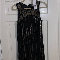 Perfect For Nye Chic Sleeveless Maxi Dress For Party Season, Glamorous A-line Sleeveless Dress For Cocktail, Glamorous A-line Sleeveless Cocktail Dress, Formal Sleeveless Sequin Midi Dress, A-line Sleeveless Dress For Evening Party Season, A-line Sleeveless Dress For Evening Parties, Sleeveless A-line Dress For Evening Parties, Embellished Sleeveless Mini Dress For Night Out, Spring Evening Embellished Sleeveless Dress