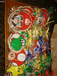 several decorated cookies in plastic wrappers on a table