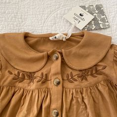 Autumn Golden Brown Long Sleeve Romper. Sweet Collar With Embroidery On The Bodice Front And Back. Bamboo Collection. New, Never Worn. Cute Brown Tops For Playwear, Cute Brown Tops For Playtime, Brown Romper, Kate Quinn, Brown Long Sleeve, Long Sleeve Romper, Sleeved Romper, Golden Brown, Tan Brown