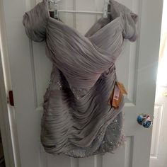 a dress hanging up on a door