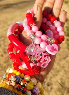 Beautiful 5 piece pink & red bracelet stack Eyelashes Tutorial, Girly Bracelets, Neon Room, Red Bracelet, Wrist Jewelry, Red Bracelets, Funky Jewelry, Bangle Bracelets With Charms, Glass Bracelet