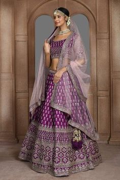 Purple attached cancan panelled lehenga with zari thread, sequin embroidery in floral pattern. Paired with half sleeve padded blouse and dupatta.
Components: 3
Pattern: Embroidery
Type Of Work: Zari thread, sequin, floral
Neckline: U neck
Sleeve Type: Half
Fabric: Raw Silk
Color: Purple
Other Details: 
Lehenga Length: Approx 45-46 inches
Panelled lehenga
Side and back tassel tie-up
Sheer embroidered dupatta
Occasion: Bride - Aza Fashions Panelled Lehenga, Scoop Neckline Blouse, Lehenga Sarees, Embellished Lehenga, Raw Silk Embroidery, Purple Lehenga, Sari Lehenga, Orange Lehenga, Beautiful Lehenga