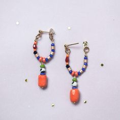 Statement Earrings, in Hot Orange and Blue, with a Hypoallergenic Stainless steel Stud post earring plated with a 18K gold. We use this material to ensuring your comfort and safety.  They were designed with natural Dalmatian Jasper, carefully selected Czech glass beads and  Crystal beads ,creating a unique combination.  Please note that the beads used in these earrings may vary slightly, adding to their unique charm.  ITEM DETAILS:  *Total length 45 mm from the post until the end of the pendant  *Earring post are lead and nickel free. I will prepare a pair of earrings for you, please note that they are made to order, and it could take a few days to process. They will came nice packaged in a Velvet Bag and a small Box, to protect them  during the shipment. Do you like them, but want to chec Stud Beaded Earrings, Multicolor Dangle Earrings For Everyday, Everyday Multicolor Dangle Earrings, Multicolor Dangle Earrings, Trendy Hoop Earrings With Dangling Beads, Trendy Beaded Earrings For Everyday, Trendy Orange Drop Earrings, Colorful Beads Small Hoop Earrings, Colorful Beads Small Hoop Earrings As A Gift