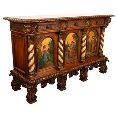 an ornate wooden cabinet with paintings on it