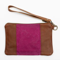 Stylish and durable, this Eastport Clutch is made to accompany you on all of your travels. Perfect for those on the go! Attach the Eastport Clutch to the inside of the Saco River tote Bag or the Fore Street Tote Bag (sold separately) to make a stylish set. Due to the nature of the leather, variations in color may occur. Made in a solar-powered workshop in Maine. Includes detachable leather wrist strap with a bronze lobster clasp built-in leather hand clutch strap zip-top closure Materials waxed Rockport Maine, Maine Gifts, Hand Clutch, Navy And Brown, Waxed Canvas, Solar Powered, Leather Purse, Zip Top, Wrist Strap