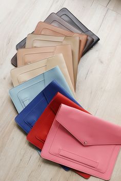 several different colored envelopes laying on the floor