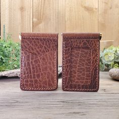 This full-grain leather Bar Clip Wallet is a great addition to your leather collection. It is now our best-selling wallet. It is made in a minimalist style and will fit nicely in your front pocket. This wallet will nicely hold a dozen bills and comes with an ID pocket, and 3 additional card pockets. These wallets come in several colors and leather hide options. All these leathers are full-grain leather and will age and patina nicely over time. *If you want this personalized with a name, initials, or a logo please add this Add-on Engraving Service to your order. Please leave a note at checkout with the name or initials. Email your logo to info@lazy3leatherco.com Specifics: 4 3/8" W x 2 3/4" H Due to the nature of tanning, the leather for these wallets will vary slightly in color and can be Brown Wallets With Rfid Blocking For Everyday Carry, Brown Textured Leather Wallet For Business, Brown Trifold Wallet With Rfid Blocking For Everyday Carry, Brown Rfid Blocking Wallets For Everyday Carry, Brown Textured Leather Business Wallet, Brown Rfid Blocking Wallet For Everyday Carry, Leather Wallets With Interior Card Slots In Cognac, Brown Wallet With Coin Pocket For Everyday Carry, Brown Wallets With Interior Card Slots For Everyday