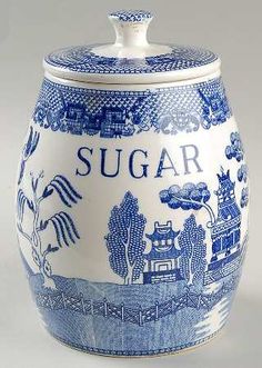 a blue and white ceramic jar with the words coffee on it