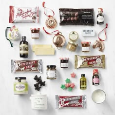 an assortment of holiday treats on a white surface