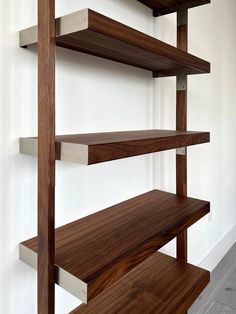 the shelves are made out of wood and metal