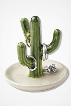 a cactus ring holder with two rings on it