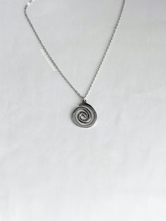 A fun, vortex necklace featuring a spiral charm on a 2mm rolo chain. An absolute essential in every jewelry collection. Our chains are 100% stainless steel and hypoallergenic so they won't rust, tarnish, or turn your neck green. - Water resistant - Lobster clasp closure - Pendant size: ~22mm - Stainless steel chain + pendant - Select desired size at checkout Swirl Necklace, Spiral Necklace, Rolo Chain, Belly Rings, Birthday Present, Stainless Steel Chain, Chain Pendants, Silver Necklaces, Ring Earrings