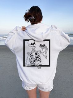 "Y2K Skeleton Hoodie Horror Hoodie Skull Hoodie Goth Hoodie Halloween Hoodie Halloween Sweaters Halloween Shirt Halloween Sweater ➭ How to Order 1. Choose your sweatshirt size & color options. 2. Select the quantity. 3. Click \"Add to Cart.\" 4. Listen for a knock at your door! ➭ Care Instructions Wash your shirt in warm water. Bleach if needed. Do not dry clean or iron directly on the design. Tumble dry on medium. ➭ Production & Shipping Processing typically takes 1-3 days. Depending on where y Oversized Hip Hop Hoodie For Halloween, Hip Hop Hoodie With Skull Print, Halloween Skull Hoodie For Streetwear, Oversized Punk Sweatshirt For Halloween, Halloween Skull Print Sweatshirt For Streetwear, Punk Halloween Hoodie Sweatshirt, Oversized Halloween Hoodie With Graphic Print, Oversized Graphic Print Hoodie For Halloween, Halloween Skull Print Hoodie For Streetwear