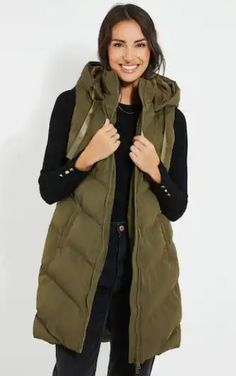 Women's Hooded Puffer Sleeveless Coat In Khaki Stay stylish and warm with the women's hooded puffer sleeveless coat in khaki. This sleek coat features a 100% polyester outer shell and a soft viscose lining for comfort. It is designed with a sleeveless hooded style and offers a modern twist on classic outerwear. The zipper closure ensures a snug fit, while two inside pockets and two side pockets provide ample storage. The khaki color adds a versatile and chic touch, perfect for layering in cooler