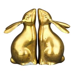 Vintage bunny bookends. Made from solid brass, in classic mid century style. Both of the bunnies are reaching up as if somebody is feeding them or if they're trying to get a delicious grass stem. Their position with the front part of body being flat makes it perfect for holding books. Long ears are definitely a star feature of these bookends, and there's also a tiny tail. Weighted inside with sand. Great condition with some natural patina from the age. Stunning rare bookends.  Approximate measur Brass Animals, Kai Kristiansen, Vintage Bunny, Animal Decor, Mid Century Style, Boho Chic Fashion, Bookends, Solid Brass, 20th Century