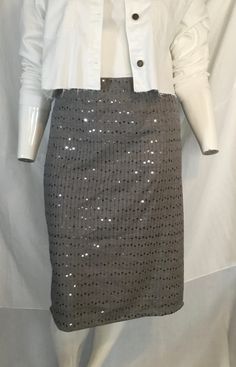 Product Description: This handmade knee-length skirt is perfect for plus-size women who love a touch of sparkle. The skirt is adorned with delicate sequins that add just the right amount of shimmer to any outfit. The elastic waistband ensures a comfortable fit for all body types, while the extended sizes cater to those who have difficulty finding fashionable clothing in their size. This skirt is made with a blend of cotton and polyester, making it durable and easy to care for.  Highlights: - Han Fitted Sequin Pencil Mini Skirt, Fitted Sequin Pencil Skirt, Fitted Sequin Pencil Skirt For Spring, Spring Fitted Sequin Pencil Skirt, Spring Sequined Fitted Pencil Skirt, Sparkling Fitted Skirt, Knee-length Sequined Party Bottoms, Sequined Knee-length Bottoms For Night Out, Knee-length Pencil Skirt For Party