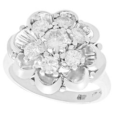 a white gold and diamond flower ring