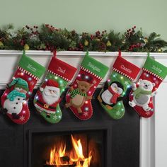 christmas stockings hanging over a fire place