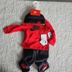 Nike Baby Boy's Footed Pants Three-Piece Set (Infant) Baby Sz 9 Months Colors: Red/Black 100% Cotton Long Sleeve Tshirt Elastic Waste Footed Pants Nwt Nike Cotton Onesie For Loungewear, Nike Cotton Playtime Sets, Nike Long Sleeve Loungewear Sets, Nike Loungewear Sets, Nike Casual Long Sleeve Onesie, Nike Red Playwear Sets, Nike Baby Clothes, Gender Reveal Outfit, Reborn Clothes