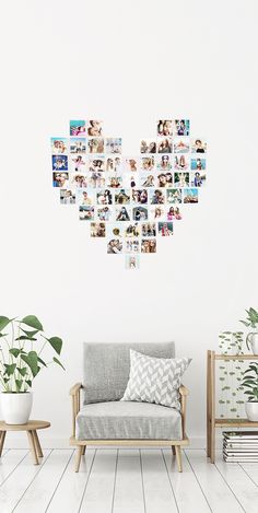 a room with a couch, potted plant and pictures on the wall above it