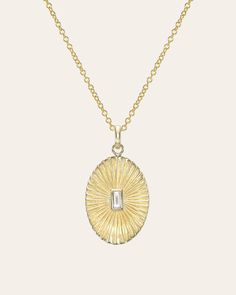 Beautifully handcrafted pleated oval with diamond baguette bezel center, 14k solid gold, chic and timeless, hanging from a cable link chain. Wear it by itself or layered, day or night. Made in L.A. Diamond Carat Weight: Approx. 0.10ctw Diamond clarity: VS Size: Approx. 19mm (H) 14mm (W) Ships in 5 to 12 business days Rush orders ship in 3 to 6 business days Comes gift ready in a custom Zoe Lev jewelry box. *Eligible for return, per our policy. See here for details. Baguette Diamond Necklace, Gold Chic, Custom Jewelry Box, Diamond Baguette, Gold Bead Bracelets, Hand Chain, Diamond Carat, Gold Hands, Bezel Diamond