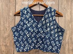 Hand printed indigo pure cotton sleeveless blouse. - Non padded  - Lined - Side zip opening - Margins inside for alteration. Note : These blouses are boutique made to standard measurements, may need some alteration for an individual's specific requirements. Blue Padded Cotton Blouse, Fitted Indigo Cotton Tops, Printed Cotton Sleeveless Blouse, Printed Sleeveless Cotton Blouse, Fitted Blue Block Print Tops, Fitted Blue Top With Block Print, Indigo Cotton Traditional Tops, Traditional Indigo Cotton Top, Indigo Cotton Batik Print Top