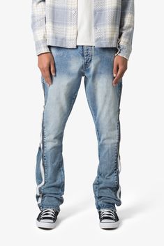 the B574 Zipper Denim are designed with our new B fit, which is relaxed through the thigh and features a slight flare at the leg opening and is constructed from medium washed blue denim, panelling at the inseam and outseam from contrasting denim for a slight flare, and finished with a exposed zipper details at the outseam. details flare at leg opening 100% cotton model is 6’1, 140 lbs and wears a size 30 Urban Style Medium Wash Flare Jeans, Urban Denim Blue Flare Jeans In Rigid Denim, Urban Style Medium Wash Rigid Denim Flare Jeans, Urban Flare Jeans In Medium Wash Rigid Denim, Streetwear Medium Wash Flare Denim Jeans, Medium Wash Denim Flare Jeans For Streetwear, Light Wash Zip Fly Jeans For Streetwear, Medium Wash Straight Leg Bottoms With Zipper Closure, High-rise Jeans With Zipper For Streetwear