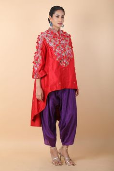 Red asymmetric tunic with floral, tassel embroidery. Paired with a contrast dhoti pant. - Aza Fashions Festive Eid Kurta With Asymmetrical Hem, Traditional Asymmetrical Hem Kurta For Eid, Festive Anarkali Kurta With Asymmetrical Hem, Embroidered Asymmetrical Hem Kurta For Eid, Eid Embroidered Kurta With Asymmetrical Hem, Festive Asymmetrical Hem Kurta For Eid, Eid Festive Kurta With Asymmetrical Hem, Red Kurta With Floral Embroidery And Traditional Drape, Festive Kurta With Dupatta And Asymmetrical Hem