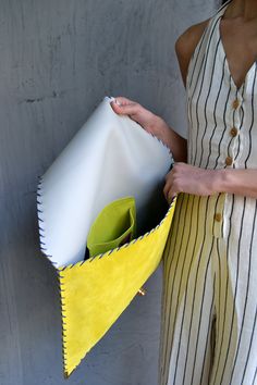 "Soft Symmetria Clutch in yellow. The perfect bag for all occasions! Ideal for cocktail and parties or for business meetings depending the size you choose. It comes in two sizes, small and large. You can use it as a chic briefcase for your work or as a modern large clutch for a night out. This adorable large clutch is handmade out of a genuine, lux Italian yellow suede leather. -Small size fits all your essentials, wallet, keys, mobile, cosmetics etc. -Large size fits a 15\" laptop, ipad, portof Large Clutch, Suede Handbags, Leather Clutch Bag, Handbag Heaven, Have Metal, Envelope Clutch, Leather Clutch Bags, Business Bag, Leather Bags Handmade