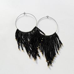 Hoop boho delicate seed bead stylish black gold evening romantic beadwoven earrings Gift for her Bohemian long fashion black earring Earrings Boho beaded made of japan Toho seed beads, silver color accessories.Closure ear wire. Length of Bohemian long fashion earrings: *3  inches. The Seed bead stylish earrings will be an excellent addition to the evening dress, add mystery to your image, and will definitely become a noticeable accessory at any party. www.etsy.com/listing/603389436 www.etsy.com/listing/619524905  www.etsy.com/listing/602396898 Bohemian Black Tassel Earrings With Round Beads, Black Bohemian Tassel Earrings With Round Beads, Bohemian Black Beaded Evening Jewelry, Black Dangle Hoop Earrings For Festivals, Bohemian Chandelier Earrings With Gold Beads For Party, Bohemian Gold Beaded Chandelier Earrings For Party, Black Fringe Jewelry For Festival, Handmade Black Dangle Hoop Earrings, Bohemian Black Hoop Earrings With Dangling Beads