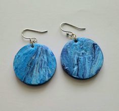 1.5 inch wood circle drop with acrylic pour in royal blue, light blue and deep magenta. Back is painted royal blue.  Clear coated for durability. Silver earwires. Nickel-free Blue Circular Earrings, Blue Nickel-free Round Earrings, Nickel-free Blue Earrings, Blue Circular Earrings For Gifts, Blue Circle Earrings As Gift, Blue Circle Earrings For Gifts, Blue Round Pendant Earrings As Gift, Blue Round Pendant Earrings For Gift, Deep Magenta