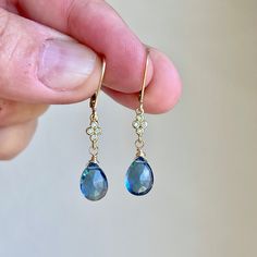 Blue Topaz Earrings, Dark Blue Teardrop Dangle Earrings, December Birthstone, Navy Drop Earrings Gold or Silver, Gemstone Gift for women  These precious delicate earrings feature dark blue topaz teardrops adorned with a white topaz connector in either gold filled or sterling silver. The earrings are suspended from lever back ear wires in the finish of your choice. These navy earrings are very feminine and a small pop of color for a blue loving girl. Ideal gift for a December birthday since this Blue Briolette Earrings Fine Jewelry, Elegant Blue Teardrop Pendant Earrings, Sapphire Briolette Gemstone Earrings, Teardrop Blue Topaz Earrings, Blue Gemstone Accented Drop Earrings, Blue Gemstone Crystal Drop Earrings, Blue Drop Earrings With Gemstone Accents, Sapphire Hypoallergenic Drop Earrings, Hypoallergenic Sapphire Drop Earrings