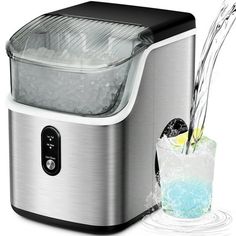 a silver and black ice maker with a drink in it