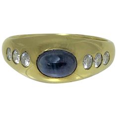 14 karat yellow gypsy style ring Oval cabochon blue sapphire approximately 6mm x 4.5mm x 3.5mm, approximately 1.40 carat, set horizontally 6 round diamonds approximately .36 total diamond weight Stamped "14K" and the Felix B. Vollman jewelry mark Size 8 Sapphire Ring Vintage, Diamond Dress Ring, Vintage Sapphire Ring, Sapphire And Diamond Earrings, Contemporary Engagement Rings, Black Beaded Jewelry, Sapphire And Diamond Ring, Sapphire Diamond Ring, Ring Oval