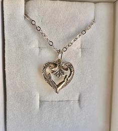 Please be sure to inspect pictures and descriptions carefully as I do not accept returns, exchanges or cancellations Super cute vintage heart pendant on a newer 925 sterling silver chain. --Necklace is light in weight. --Pendant is approximately 1/2 inch and has been put on a newer sterling silver chain. --Chain is approximately 17 inches.  925 STERLING SILVER --Necklace and chain have been cleaned and polished. --There is some slight patina inside and outside which add to the charm. --Pendant is vintage sometime pre 1960. Comes with a gift box and polish cloth. Private estate piece in excellent condition.  The vintage heart pendant was boxed for many years.  There are no markings that I could find on the pendant.  Was told it is sterling silver. It is not magnetic, so I'm inclined to beli Vintage Charm Heart Pendant Jewelry For Anniversary, Elegant Heart Necklace With Vintage Charm As Gift, Heart Pendant Necklace With Vintage Charm For Anniversary, Vintage Heart Pendant Necklace For Anniversary, Anniversary Heart Pendant Necklace With Vintage Charm, Vintage Sterling Silver Charm Necklaces For Anniversary, Vintage Charm Heart Pendant Necklace For Anniversary, Vintage Sterling Silver Heart Charm Necklace, Anniversary Necklace With Vintage Charm And Heart Pendant