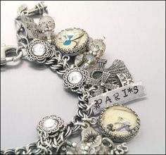 A Paris charm bracelet! Antique Souvenir Jewelry With Charms, Vintage Antique Silver Charm Bracelet For Gift, Vintage Antique Silver Charm Bracelet Gift, Vintage Antique Silver Charm Bracelet As Gift, Antique Bracelets With Vintage Charm As Gift, Antique Adjustable Charm Bracelet Gift, Vintage Engraved Charm Bracelet Gift, Nickel-free Silver Bracelets As Souvenir, Silver Nickel-free Bracelet Souvenir