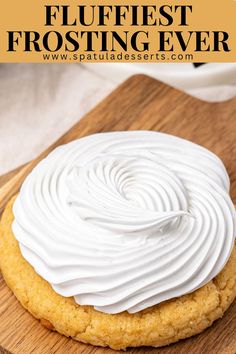 a close up of a frosted cookie on a wooden board with text overlay