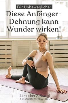 a woman sitting on top of a yoga mat