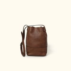 Madison Leather Bucket Bag | Dark Hazelnut Keep Private, Buffalo Jackson, Madison Brown, Popular Handbags, Bag Dark, The Madison, Striped Fabric, Leather Bag Women, Leather Bucket Bag