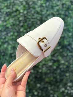 White slip on mule with Gold buckle detail Fit: True to size *ALL shoes are shipped out of box!* Girly Tops, Slip On Mules, White Slip, Denim Romper, Ruffled Sleeve Top, Spring Sale, Ruffle Dress, Sale House, Shoe Brands