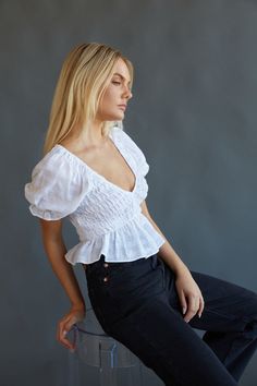 Day or night, you can't go wrong with the Melissa Puff Sleeve Crop Top! This feminine top features a v neckline, smocked bodice, puff sleeves, and a ruffle hem. Pair with Levi's Ribcage Wide Leg Jeans in Rosie Posie to compete the look! Details 100% Cotton Slip on Elastic band on sleeves Hand wash cold / Line dry Levi's Ribcage, Rosie Posie, American Threads, Cotton Slip, Feminine Top, Puff Sleeve Crop Top, White Crop Top, Ruffle Hem, Wide Leg Jeans