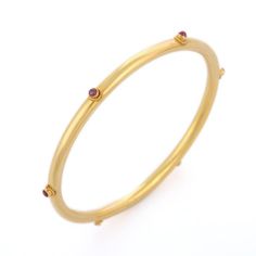 This is part of Chairish’s Fine Jewelry assortment.  Ruby Bangle in 18K Gold. It’s a great jewelry ornament to wear on occasions and at the same time works as a wonderful gift for your loved ones. These lovely statement pieces are perfect generation jewelry to pass on. Bangles feel comfortable while wearing it as it is lightweight, designer and skin friendly. Our handmade solid gold bangles are a stylish accessory which is perfect for your daily casual wear or work formal wear. This is a perfect Single Gold Bangle, Solid Gold Bangle, Ruby Bangles, Yellow Gold Bangle, Gold Bangles Design, Bridesmaid Bracelet, Bangle Designs, Gold Bangle Bracelet, Gold Bangle