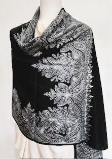 Our Embroidered Shawl features fine embroidery on soft 100% merino wool. Specialty piece. This classically beautiful shawl showcases the intricate embroidery traditions of Northern India with stunning embroidery in metallic tones on a black base. Suitable for a black tie event, evening out, dinner party. Can change the look of last year's dress or pantsuit. A formal living room, drape over the back of the couch. The high quality and elegance of our embroidered shawls make them treasures that wil Luxury Black Pashmina Shawl For Festive Season, Luxury Wedding Embroidered Shawl, Luxury Self-design Shawl For Festivals, Black Pashmina Shawl With Embroidered Border, Elegant Black Festive Shawl, Elegant Black Pashmina Shawl With Embroidered Border, Elegant Black Pashmina Shawl For Festive Occasions, Elegant Black Scarf For Festive Season, Elegant Black Scarves For Festive Season