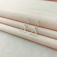 Dangle Earrings, Dainty Dangle Earrings, Triangle Dangle Earrings, Triangle Earrings, Triangle Jewelry, Wire Backs Earrings, Birthday Gifts ♡ Triangle Dangle Earrings ♡ Welcome to my shop, All our produtcs handmade with love. Handmade silver earring is a very nice and dainty gift that you can buy for your loved ones or yourself.   ♡ Materials: High Quality 925 Sterling Silver, Gold Plated Silver and Rose Gold Plated Silver ♡ All jewelry will be carefully packaged and sent in a special gift box. I hope you can find your personalized necklace that suits you in our store. For other samples, please visit our store. ♡ HOW TO ORDER ♡ 1- Choose Color and Option  2- If there is any other information you want to specify, please message us. 3- Click "Add to cart" or " Buy it now" Thanks ♡ PROCESSING Triangle Metal Earrings For Gift, Triangle Shaped Single Earring As A Gift, Triangle Single Earring As Gift, Nickel-free Triangle Earrings As Gift, Minimalist Triangle Hoop Earrings As Gift, Hypoallergenic Triangle Earrings For Gift, Triangle Earrings As Gift, Triangle Pierced Earrings Gift, Triangle Pierced Earrings As Gift