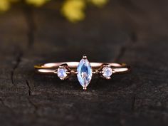 Marquise Moonstone engagement ring,3 stone ring,antique art deco wedding ring,delicate ring,14K rose gold thin band,minimalist ring,gifts Solid 14k or 18k white/ rose/yellow gold 6x3mm Marquise Cut Natural Moonstone 2mm round cut natural moonstone Prong set Return and refund: We provide 30days return and exchange service. (Custom order is made by Unique demand, will be non-returnable and non-refundable). As every item in my shop is handmade to order, if you unsatisfied with it and would like to Engagement Ring 3 Stone, Rainbow Moonstone Engagement Ring, Ring 3 Stone, Deco Wedding Ring, Art Deco Wedding Ring, 3 Stone Ring, Antique Wedding Rings, Art Deco Wedding Rings, Moonstone Engagement